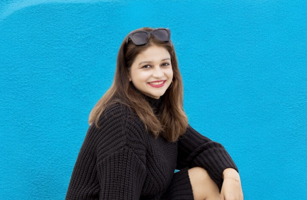 Technical recruiter and HR professional Pratibha Singh against an AI-generated blue background