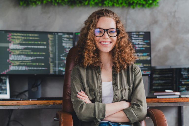 How To Address the IT Talent Shortage: 8 Ways To Improve Your Company’s Recruiting Process Female software developer in front of her workstation