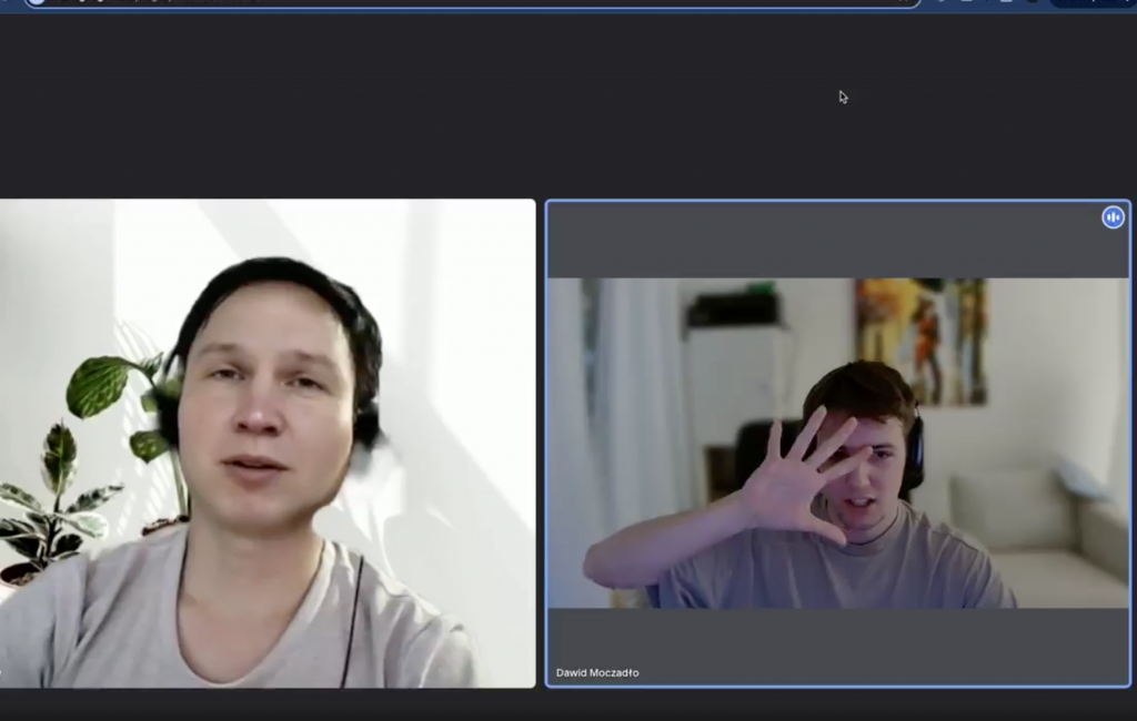 Dawid Moczadło, Co-Founder of the code security platform Vidoc, asks a fake applicant (left) to place their hand in front of their face