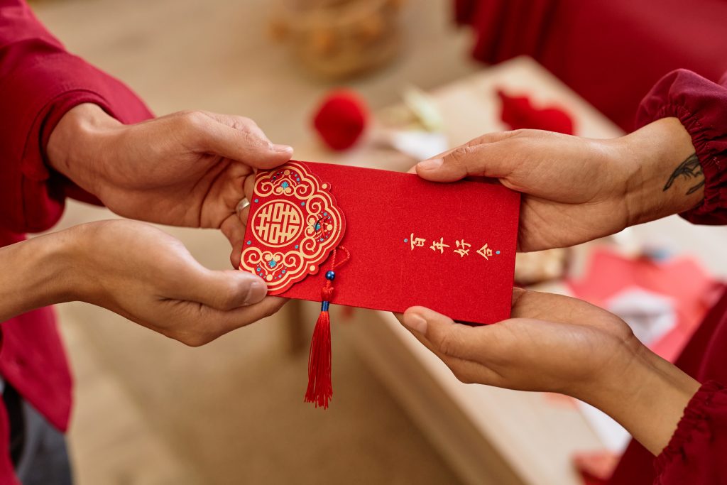 In China, red envelope etiquette includes receiving the envelope with both hands as a sign of respect.